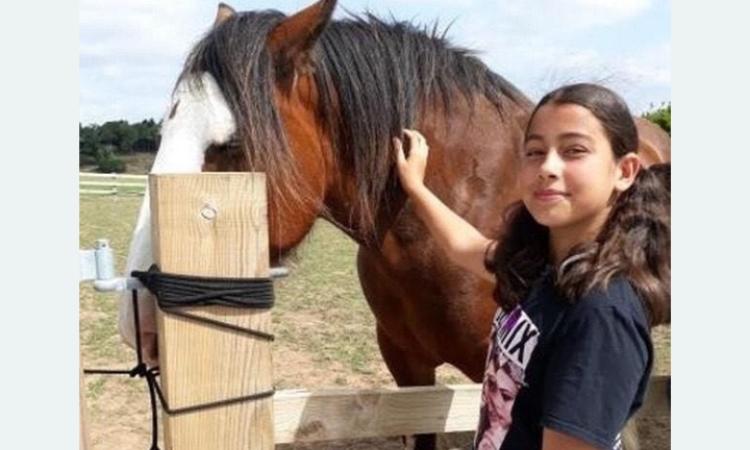 Photo of Lucy with a horse