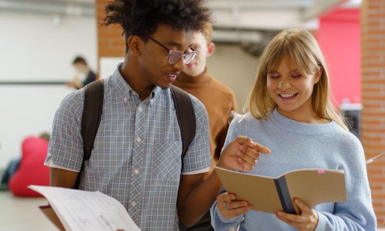 Young people walking with school books
